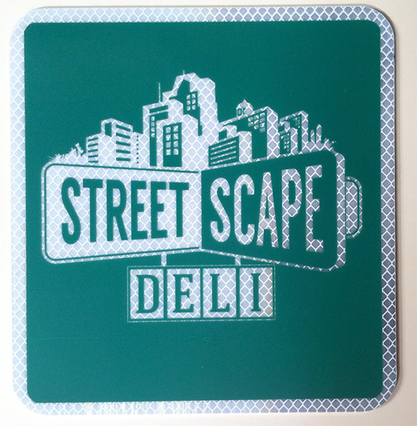 Tucson print shop creates a reflective, metal sign for Street Scape Deli. 